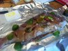 Pink Snapper stuffed with chilly, lime, bacon stuffing, doused with soy sauce webber cooked