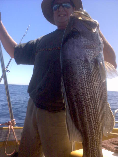 bro;s 10kg-his first hook up was two dhuies -both returned  succsesfully then on the next drop a 10kg fish