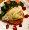 Snapper, topped with lemon butter on a bed of mashed sweet potato, steamed veg and roast tomatoes